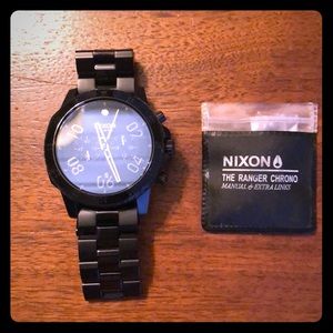 Barely worn Black with Gold trim Nixon watch.